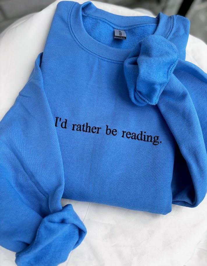 Embroidered sweatshirt that says &quot;I&#39;d rather be reading&quot;.
Perfect for a book lover gift.
Bookish TikTok themed.
Reading lovers crewneck